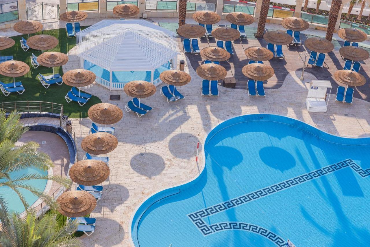 Enjoy Dead Sea Hotel Ein Bokek Exterior photo Aerial view of the pool at Atlantis Paradise Island