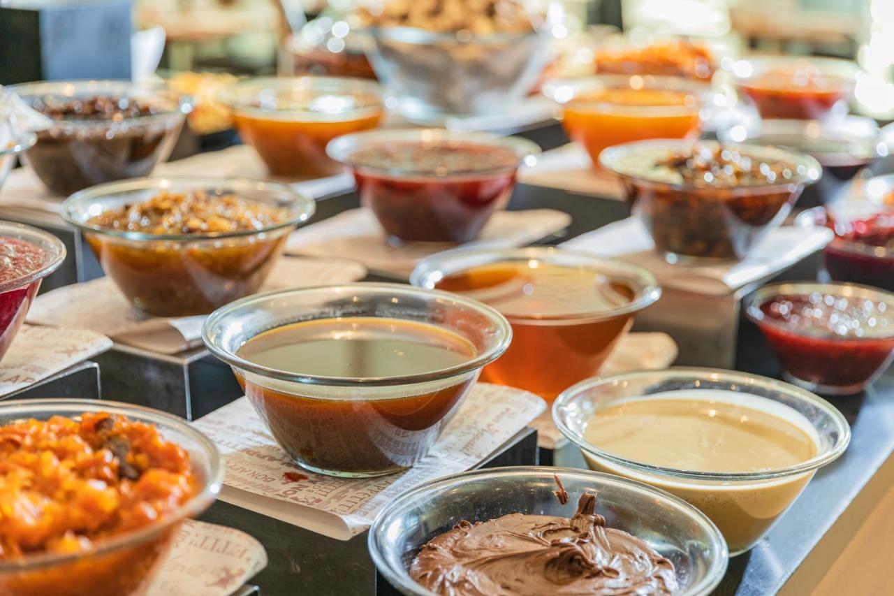 Enjoy Dead Sea Hotel Ein Bokek Exterior photo A selection of various sauces