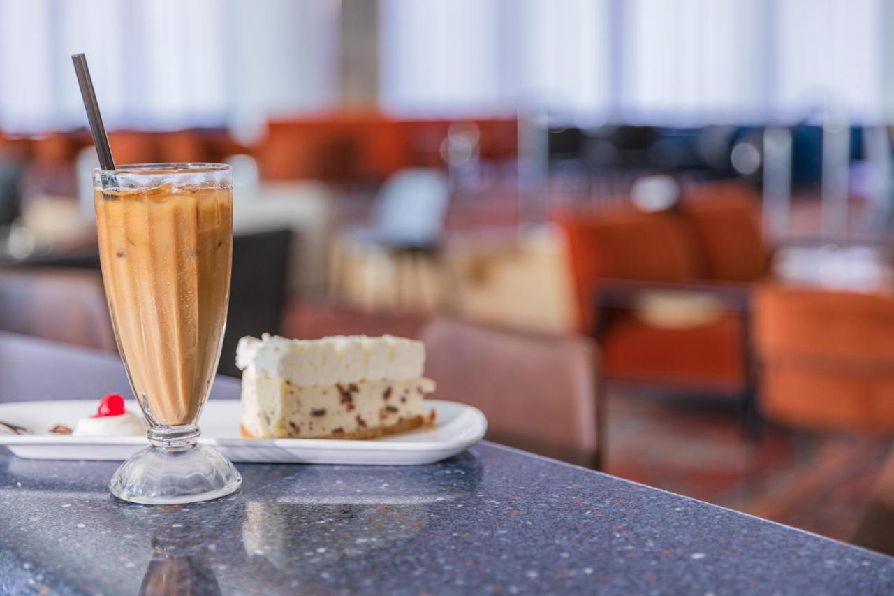 Enjoy Dead Sea Hotel Ein Bokek Exterior photo A glass of iced coffee