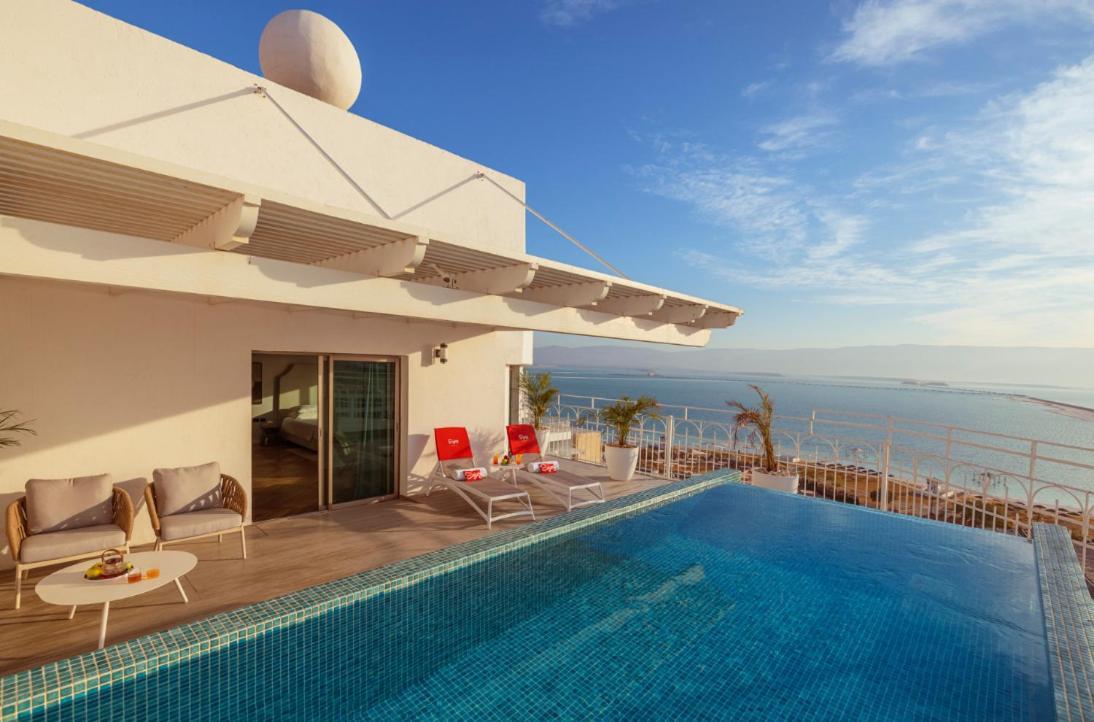 Enjoy Dead Sea Hotel Ein Bokek Exterior photo The rooftop pool at the hotel